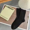 Calcetines estilo Meilad para mujer para otoño e invierno, con diseño de hilo de puntos, color liso, longitud hasta la mitad de la pantorrilla, versátiles, gris retro, tonos cálidos y estilo simple