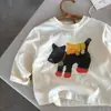 Novas Camisetas de Desenho Animado para Meninos e Meninas da Primavera e Outono de 2026, Tops Versáteis de Manga Longa 100% Algodão Infantil, Camisas Estilosas com Estampa para Camada Base