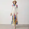 Terno plissado estampado estilo europeu e americano com gola semi-alta, mangas compridas, cintura alta e saia longa com barra larga estampada para mulheres
