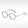 Gafas de montura ovalada pequeña y fresca, pegamento dorado de moda T22055, semi-titanio, se pueden equipar con montura óptica para miopía, anti-luz azul