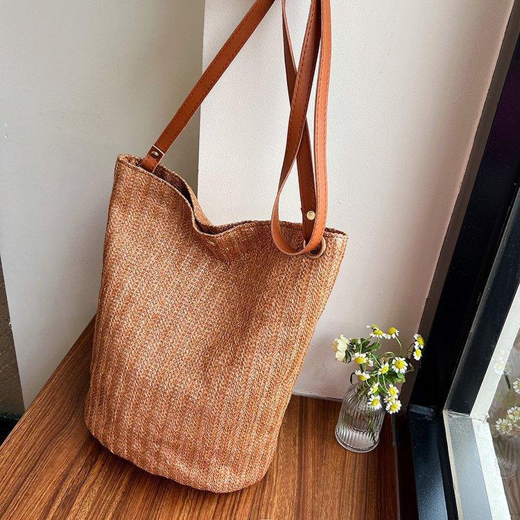 编织包女包新款潮2024夏草编简约百搭小清新水桶包个性单肩斜