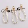 Estilo Nuevo de Primavera Chanel Perla Cadena de Mano DIY Hecho a Mano Bolso Casero Funda para Teléfono Móvil Llavero Accesorios