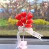 Adornos para coche rojos de red, directos de fábrica, para consola central, globo con cabeza móvil, adornos para interior de coche para damas