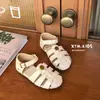 Nuevos Zapatos de Verano para Niños 2026 Estilo Coreano Moda Retro Flor de Camelia Sandalias Romanas Cerradas para Niñas
