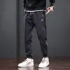 Pantalones casuales de primavera y otoño marca de moda para hombre sueltos atados al tobillo Pantalones deportivos para hombre ropa americana resistente al desgaste de talla grande overol con costuras