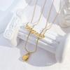 Nuevo collar de moda de doble capa que combina con todo, con letras de viento frío, cierre de cabeza de serpiente y hueso, collar superpuesto con cadena de clavícula sin color para mujer.