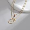 Colar Feminino INS Design de Nicho Titânio Aço Artístico Retrô Ouro 14K Lua Oca Zircônia Corrente de Lã Pérola