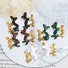 Aretes colgantes de eje de color colorido estilo Chanel de lujo ligero europeo y americano, acero de titanio, perro mecánico, aretes dulces lindos, joyería femenina
