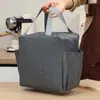Trabajador de oficina mano llevando bolsa lonchera bolsa aislante de papel de aluminio bolsa de almuerzo de gran capacidad bolsa de almuerzo engrosada de aspecto elegante