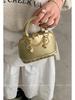 Diseño de nicho bolso de mano de alta gama bolso pequeño 2025 nuevo bolso concha oro champán moda bolso de hombro diagonal
