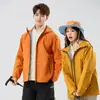 2025 Nueva Chaqueta de Plumas para Hombre Tres en Uno Otoño e Invierno Impermeable y Cortavientos Chaqueta Cálida con Forro de Plumas para Mujer
