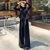 Traje de otoño elegante y versátil, compuesto por un chaleco blazer sin mangas de cuello en V hecho a medida y pantalones anchos rectos largos con caída.