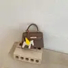 Bolsas Femininas 2026 Nova Tendência Alta Qualidade Moda Versátil Ombro Transversal Bolsa de Mão Design de Nicho Bolsa Kelly