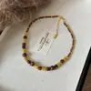 2025 Estilo Caliente Collar Retro de Piedra Ojo de Tigre Maillard Elegante Versátil Cadena para Clavícula Lujo Ligero Collar de Gama Alta Venta al por Mayor