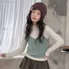 Conjunto de otoño para niña 2026 nuevo estilo: top de punto tipo camisola con falda acampanada y pantalones de pierna ancha, conjunto infantil en capas estilo coreano
