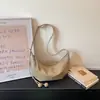 Bolsa Dumpling Simples e Moderna 2026 Verão Nova Moda Feminina para o Dia a Dia Transversal Casual Personalidade Bolsa de Ombro para Mulheres