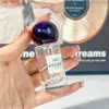 Botella dispensadora de perfume de alta gama 25 ml Botella de spray de vidrio 30 ml Botella de presión de nanorociado Botella vacía de repuesto portátil