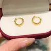Sha Jinjiu no se decolora durante mucho tiempo, el pendiente de clip para oreja con forma de flor de coche estrella, cara de corte irregular de lujo ligero, pendiente de oreja