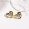 Pendientes de botón de corazón bitono con baño de cobre, estilo minimalista europeo y americano, con sentido del diseño, Pendientes de corazón a rayas de moda y sencillos