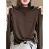 Camiseta de manga larga con botones de alta gama para mujer, diseño de otoño 2026, top de moda nicho elegante y versátil