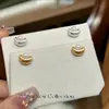 Pendientes de botón de perla en lingote de oro cepillado de plata pura S999 para mujer, nuevos pendientes populares de diseño de nicho 2026