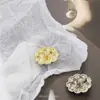 Botón metálico de flor tejida de imitación de alta calidad, botón para abrigo trench de mujer, chaqueta de traje, botón con diseño para abrigo de cachemira
