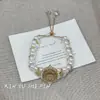 Novo Bracelete de Gato da Sorte Estilo Chinês Pérola Dupla Camada para Mulheres 2025 Novo Modelo Luxo Leve Elegante High-End Design de Nicho Joia