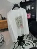 Recomendación PrincipalColección Nueva Primavera/Verano 26 de Yuran: Camisa Larga Oversize con Estampado de Sellos Vintage de Mezcla de Algodón y Lino