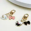 Llavero de gatito lindo Colgante creativo Regalo Nuevo Transfronterizo Colgante de mochila de metal Colgante de auriculares