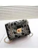 Bolsa Feminina de Guangzhou 2025 Nova Moda Bolsa Quadrada Pequena Transparente Decorada com Flores Bordadas Bolsa de Ombro Bolsa Carteiro de Grande Capacidade