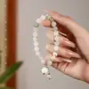 Pulsera de Jade Tianshan de Lujo Accesible en Nicho para Mujeres Pulsera de Perlas y Muguetes Retro como Regalo para Mejores Amigas