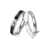 Anillo de pareja de unión blanco y negro para hombre y mujer diseño de nicho ins anillo cruzado moda versátil anillo de pegamento blanco y negro