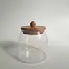 Entrega de fábrica Tarro sellado de vidrio de borosilicato alto vidrio resistente al calor tapa de bambú tarro para té tarro triangular tarro de almacenamiento botella de almacenamiento