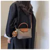 Bolsa de Nylon Fresca e Simples para Mulheres 2025 Nova Moda Versátil Bolsa Transversal Texturizada Bolsa de Ombro Venda por Atacado