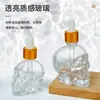 Botella de Perfume de Calavera Cosméticos Botella con Atomizador de Presión Botella de Muestra de Vidrio Transparente Botella Vacía Empaque Venta al por Mayor