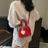 Bolsa de Bolos Portátil Niche para Mujer 2025 Nueva Moda de Primavera y Verano Bolsa Concha Texturizada Versátil Bandolera Bolsa Pequeña