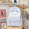 Mochila versátil de moda de verão 2026 transfronteiriça, mochila estilo japonês para alunos do ensino fundamental II e médio, leve e de grande capacidade