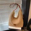 Bolsa de Playa para Vacaciones de Verano para Mujer 2026 Nueva Bolso de Hombro Tote de Paja Tejida Hueca de Gran Capacidad