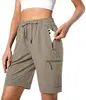 Shorts esportivos leves de secagem rápida para mulheres europeias e americanas, para camping, viagens, golfe, com bolsos com zíper e design casual à prova d'água