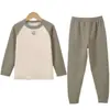 Ropa interior térmica para niños y niñas, tops y pantalones de otoño, empalme de color liso, ropa de casa sencilla, nuevo conjunto de cuello redondo 2025