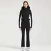 Nuevo traje de esquí de una pieza profesional para mujer para esquí al aire libre con doble tabla, a prueba de viento, cálido, impermeable, ajustado, alta elasticidad, traje de esquí transfronterizo para mujer