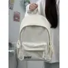 Mochila de moda de color liso con estampado de letras, simple y versátil, estilo japonés, adecuada para estudiantes de secundaria, preparatoria y universidad