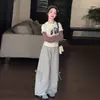 Conjunto de Camiseta Base Rayada de Dibujos Animados para Niñas 2026 Primavera y Otoño Nuevo Conjunto de Dos Piezas de Moda con Camiseta Falsa de Dos Piezas y Pantalones de Pierna Ancha