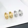 Pendientes de acero inoxidable de venta caliente transfronteriza personalidad de moda para hombres y mujeres mismos pendientes de acero de titanio color acero pendientes de oro de 18 quilates cierre de oreja