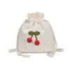 Atacado Novo 2020 Lona Fofa Bolsa de Cereja Bolsa de Bolinha de Pelo Bolsa de Ombro Bolsa de Praia Japonesa Coreana Balde Bolsa Feminina