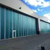 Aofei Venta al por mayor Máquina Plegable Eléctrica Grande de Giro Lateral Fabricante de Puertas de Garaje Venta Directa Taller Industrial Apertura y Cierre Automático
