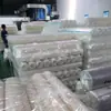 Película de embalaje transparente, muy elástica, de alta resistencia a la tracción, resistente a pinchazos, en rollo grande; película plástica comercial para sellar recipientes para llevar