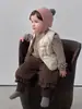Chaleco de Plumón para Niña Otoño e Invierno 2026 Nuevo Modelo Ligero Cálido para Bebé Conjunto de Tres Piezas Ropa Exterior Versátil para Bebé