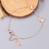 Y35 venta al por mayor de fábrica Ola coreana con mariposa de oro rosa Mori personalidad simple dulce Joyería de pie coreana dulce