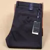 Otoño e invierno Nuevos pantalones casuales de negocios para hombre de fibra de poliéster gruesa, elásticos, rectos, de cintura media, antiarrugas, sin planchado